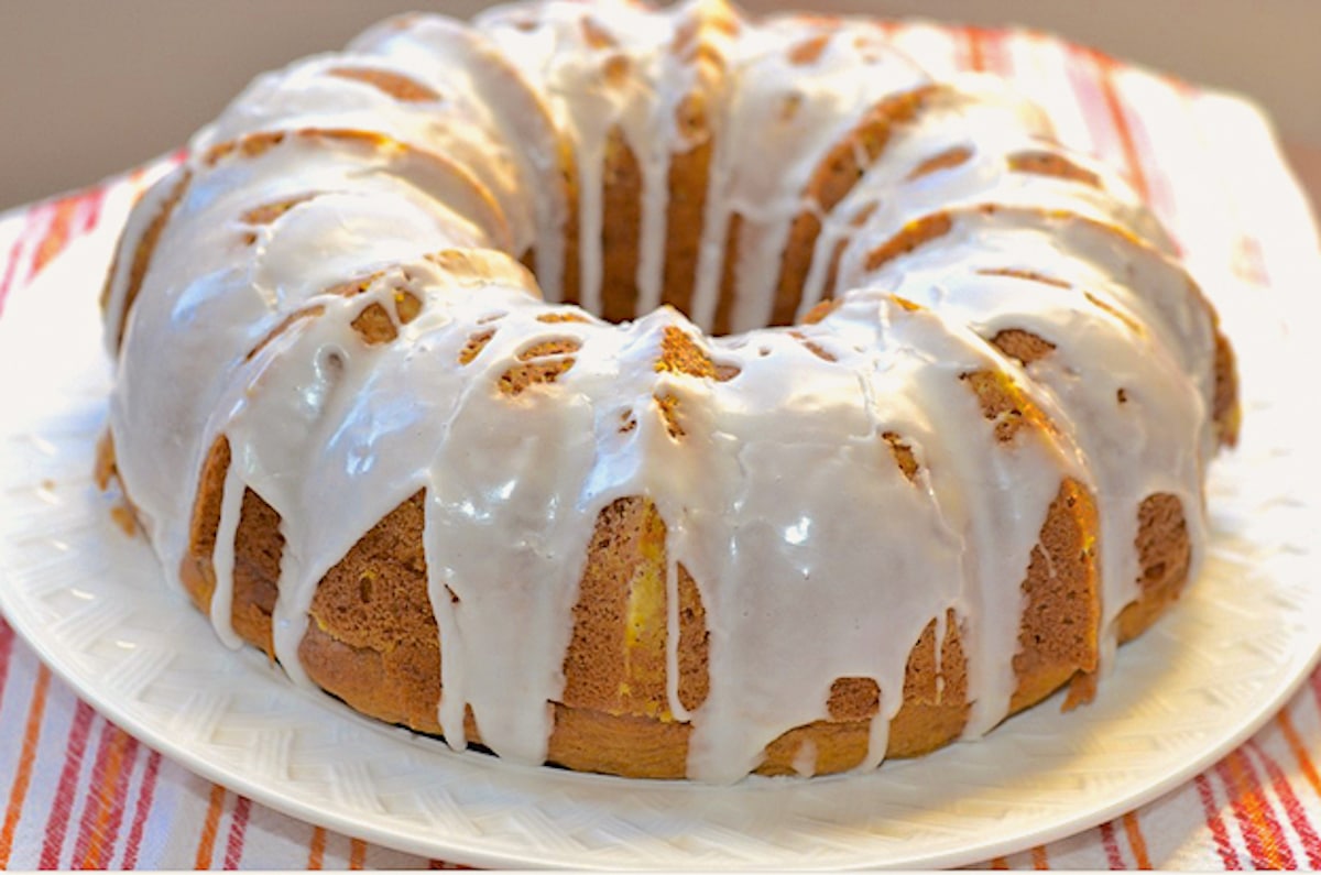 pumpkin spice bundt cake on a white platter