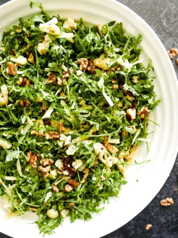 roasted cauliflower salad in a large white bowl