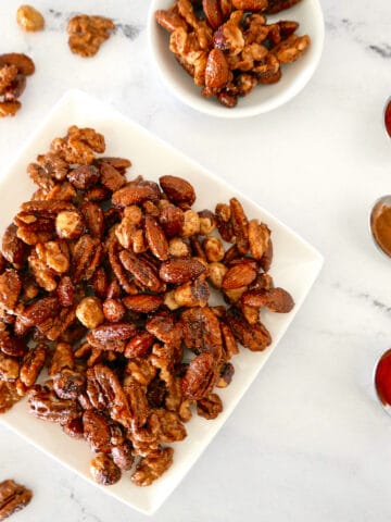 spiced candied nuts on a small plate