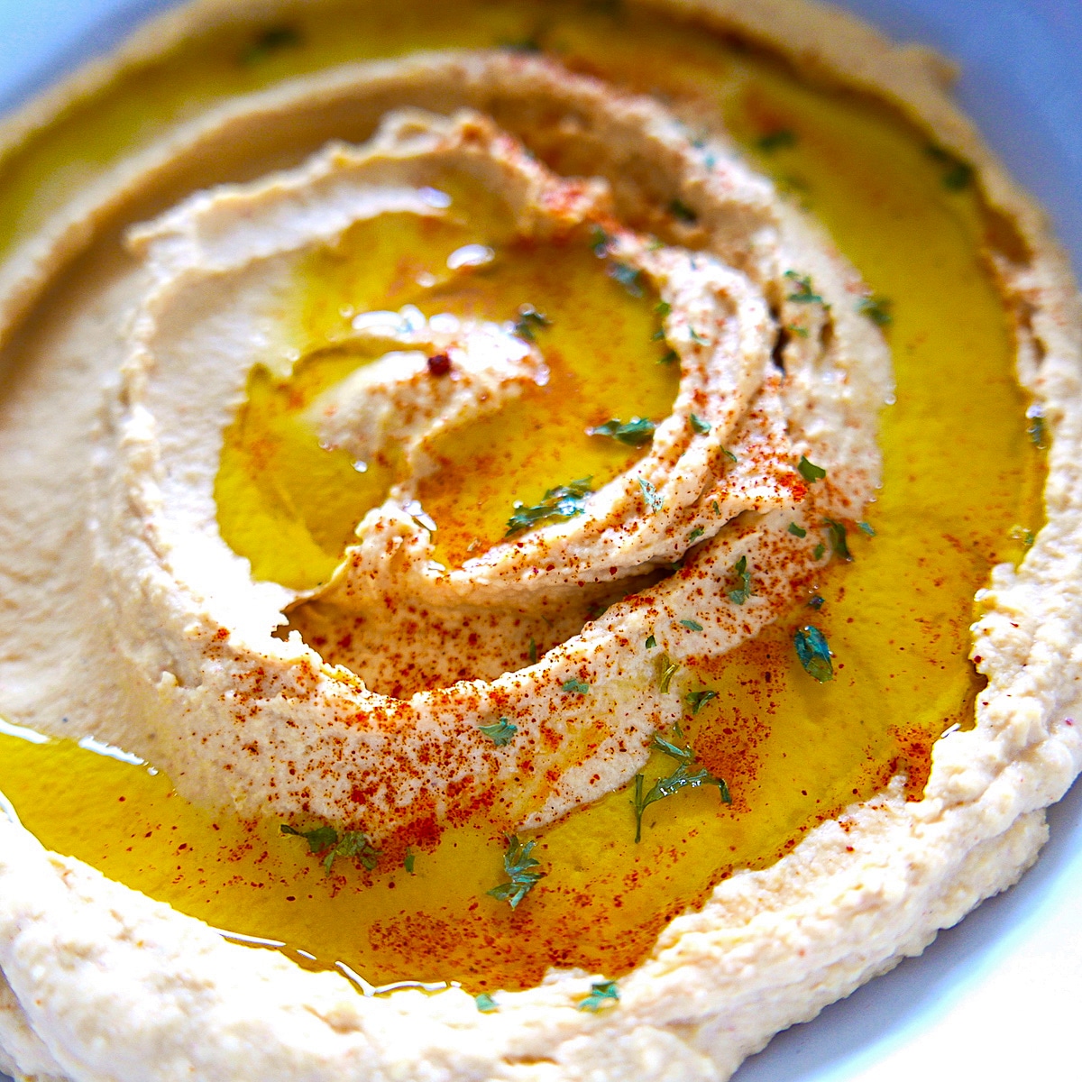 smoked paprika hummus in white bowl