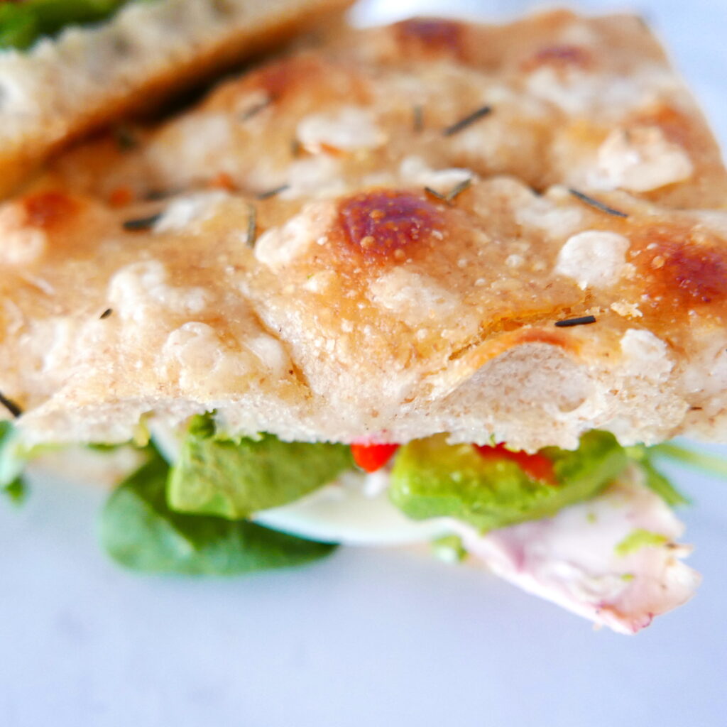 close up of rosemary garlic focaccia sandwich
