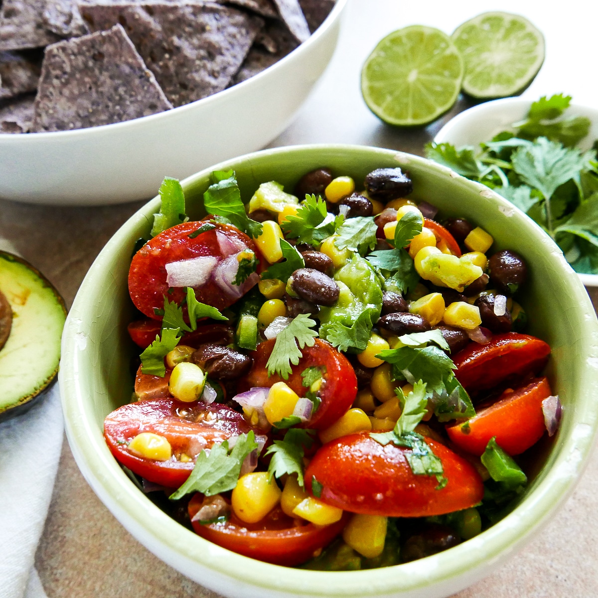 black bean corn salsa in a bowl garnished with cilantro.