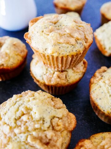 almond poppy seed muffins with almond paste streusel arranged on table