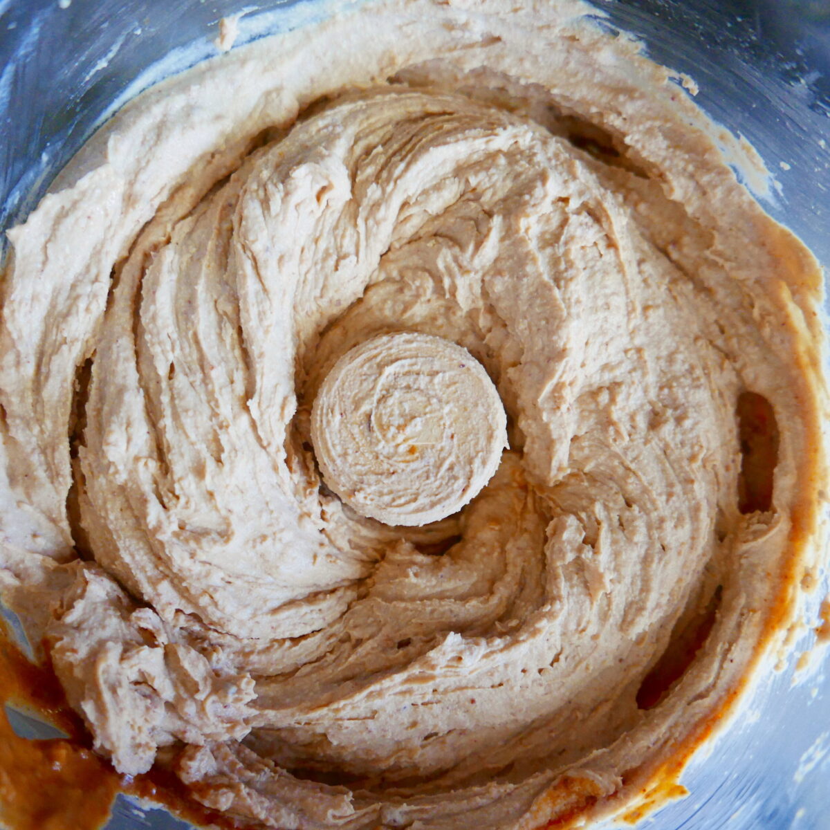 Tofu, peanut butter, non-dairy cream cheese, maple syrup, and vanilla extract in food processor.