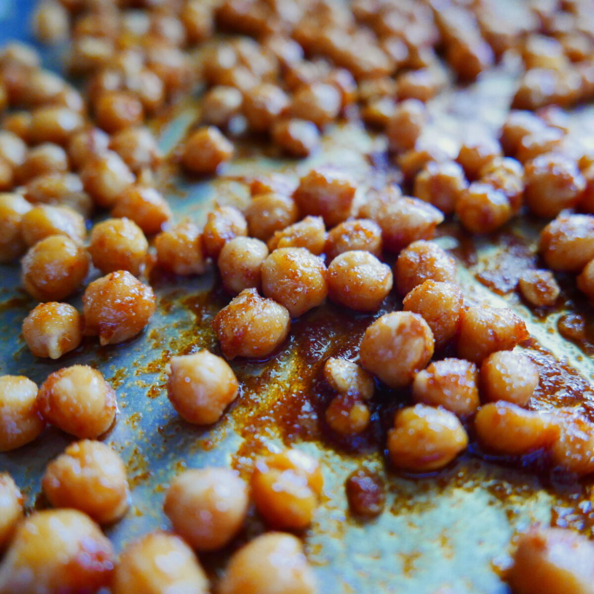 Roasted chickpeas on a baking sheet.