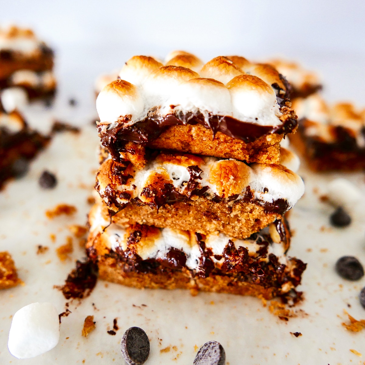 three-vegan-smores-bars-stacked.jpg three vegan smores bars stacked on top of each other.