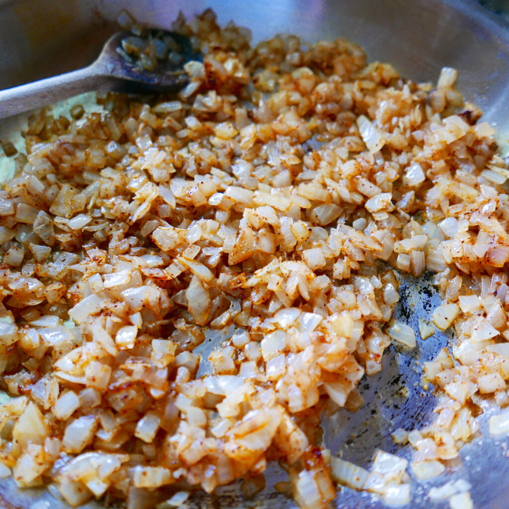 sauteeing onions in a skillet