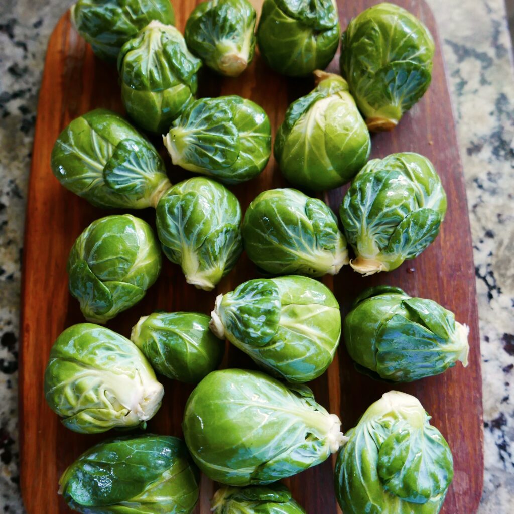 brussels sprouts on a wooden cutting board