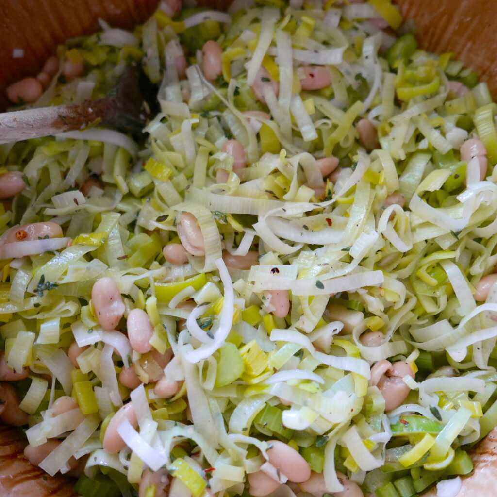 leeks and white beans in a large pot