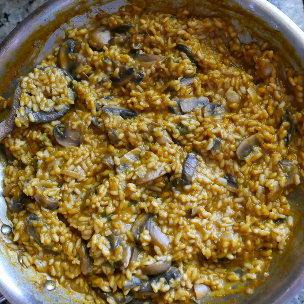 pumpkin and mushroom risotto in a skillet