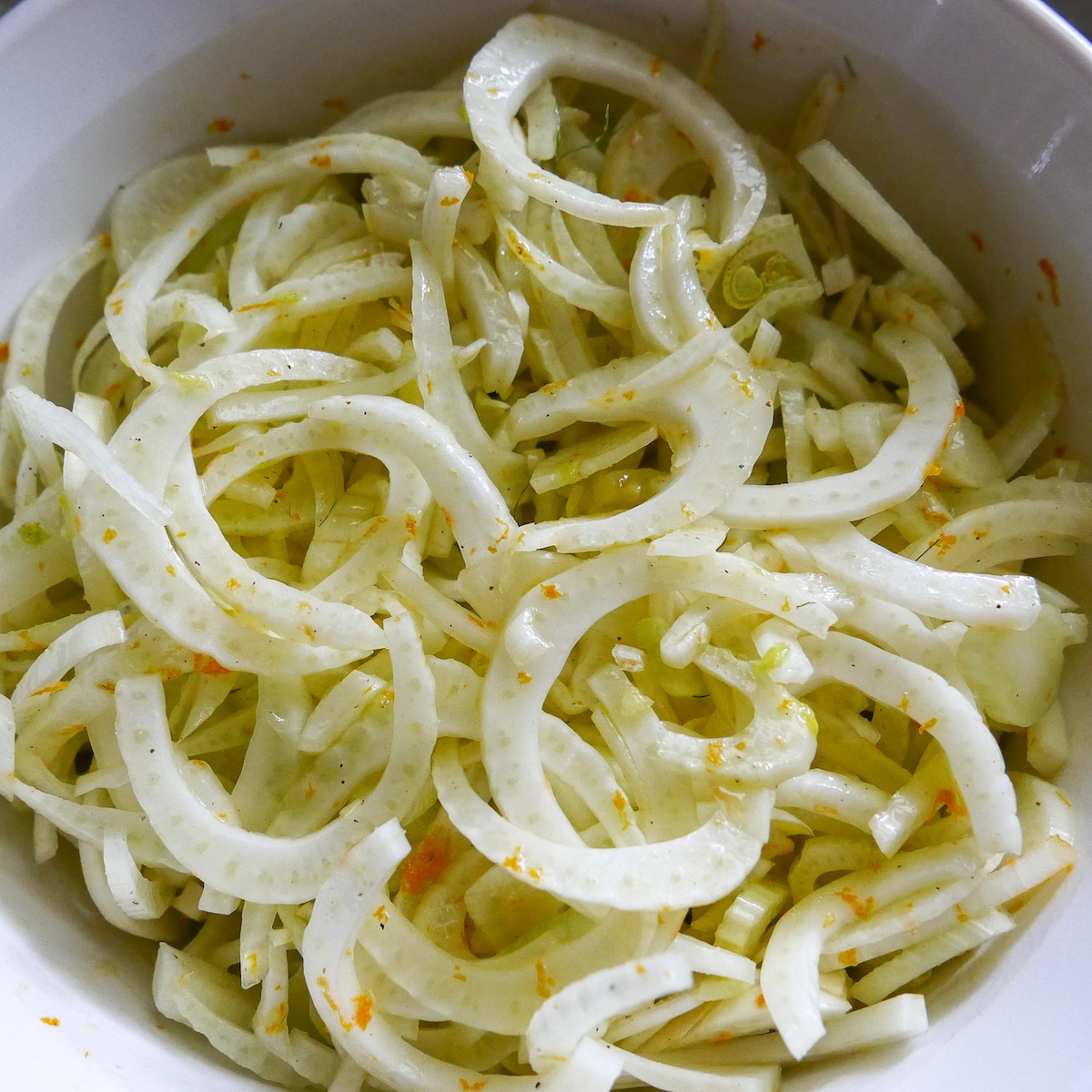 shaved fennel in a mixing bowl