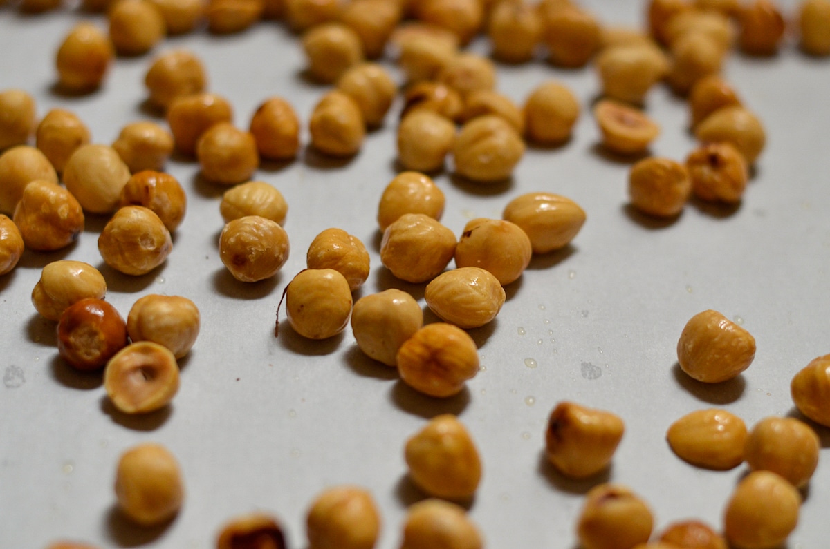 hazelnuts toasted hazelnuts on a baking sheet