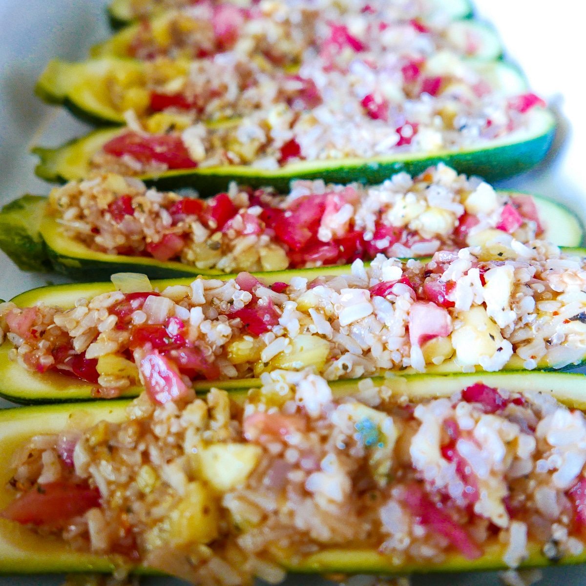 stuffed zucchini on a baking sheet
