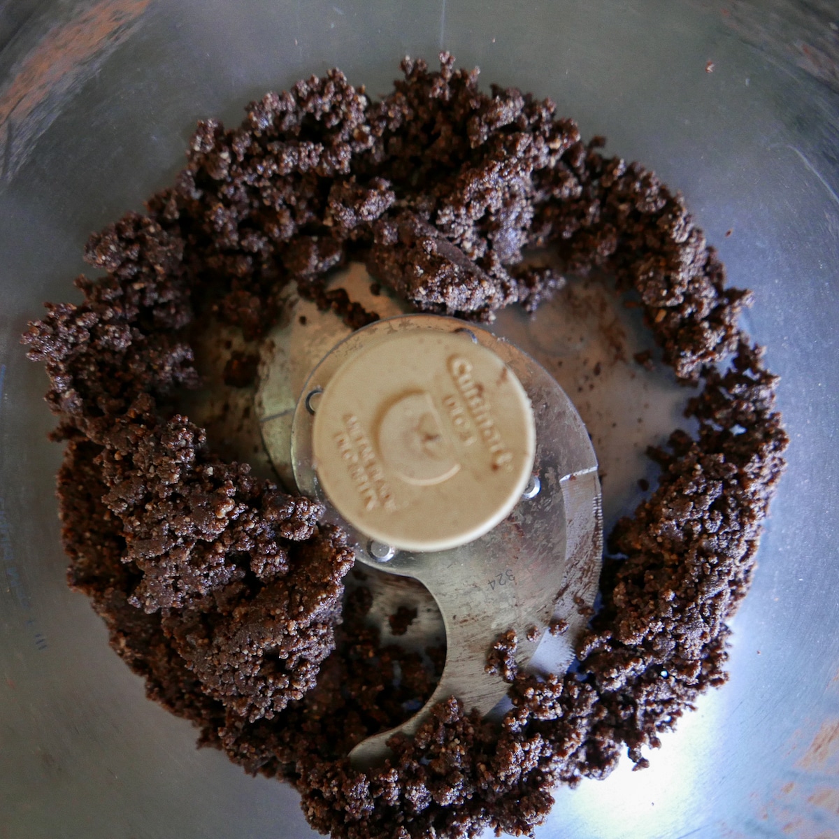 hazelnuts, cocoa powder, and melted chocolate in food processor.