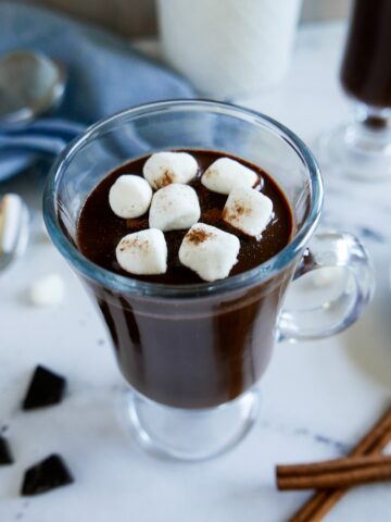 oat milk hot chocolate in a mug garnished with marshmallows