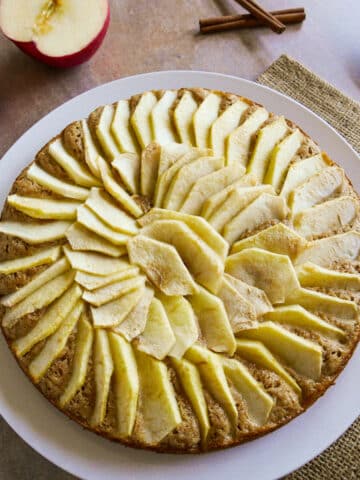 Dutch apple cake arranged on a white platter.