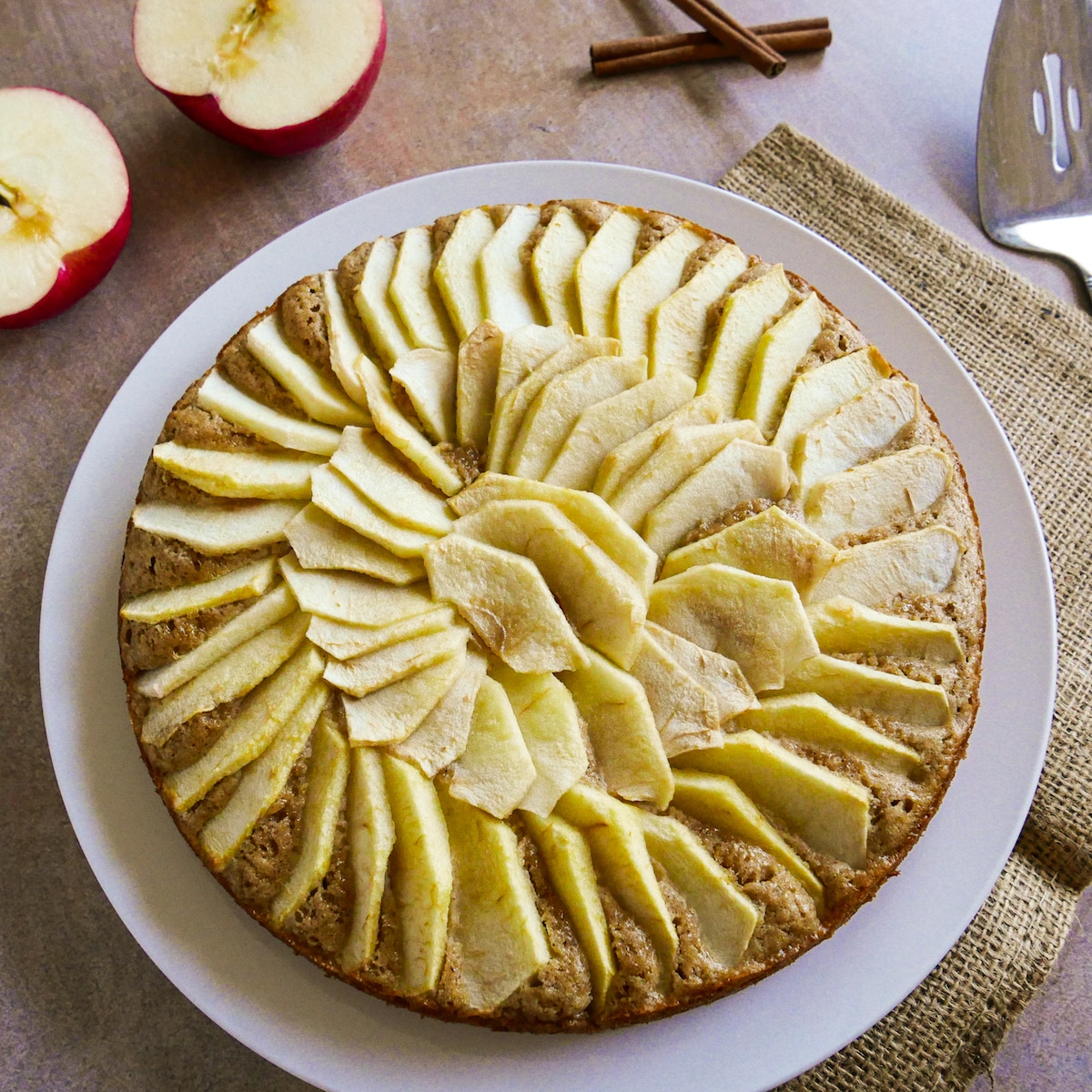 Dutch apple cake arranged on a white platter.