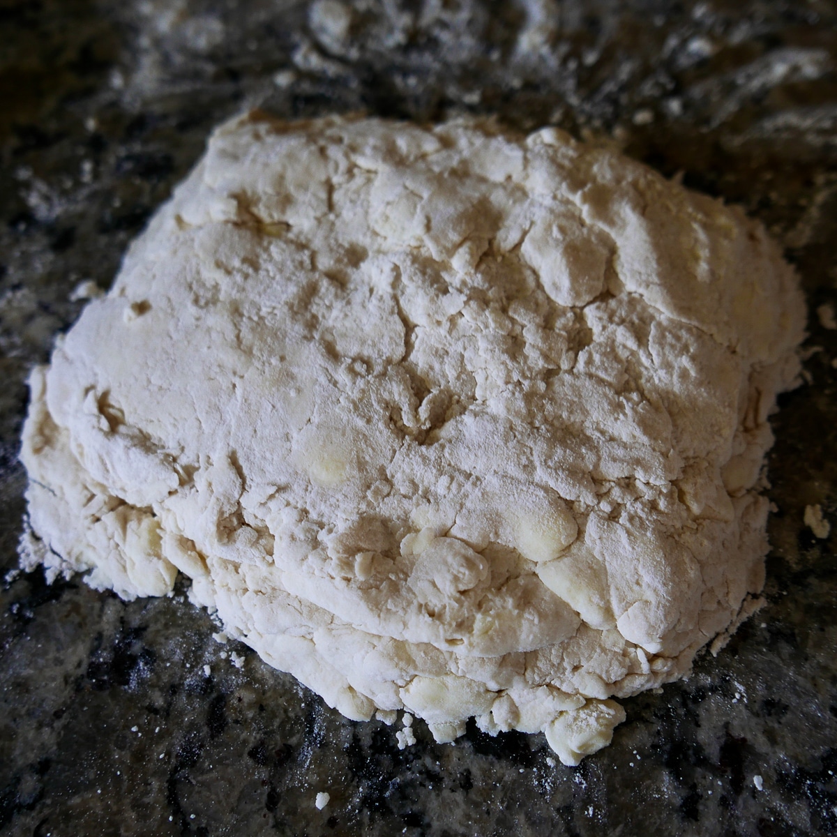 Biscuit dough on counter after first fold.