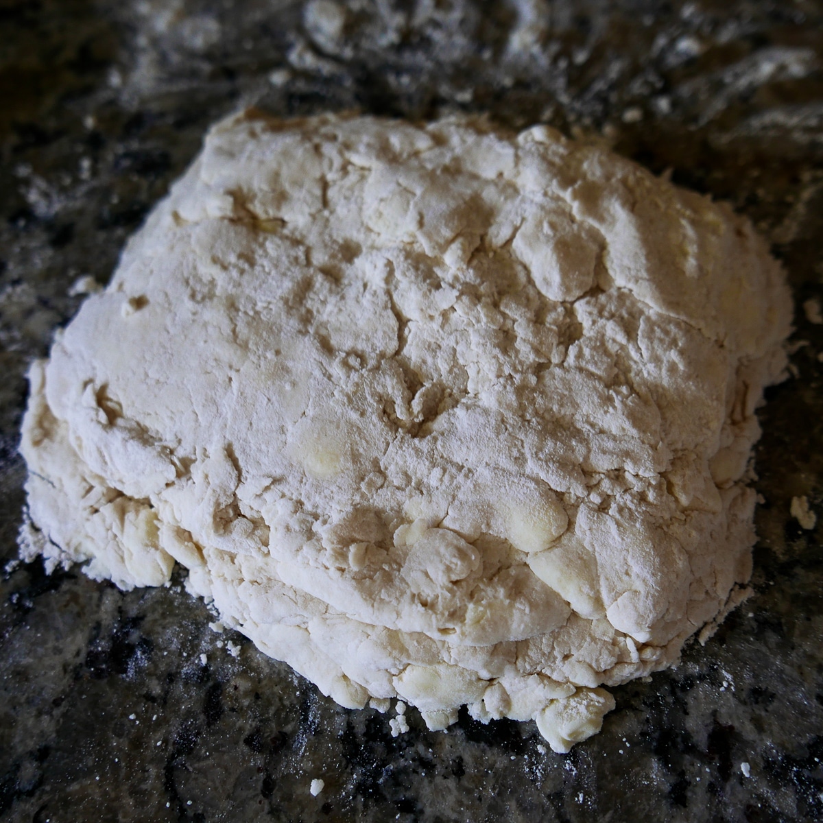 Biscuit dough on counter after first fold.