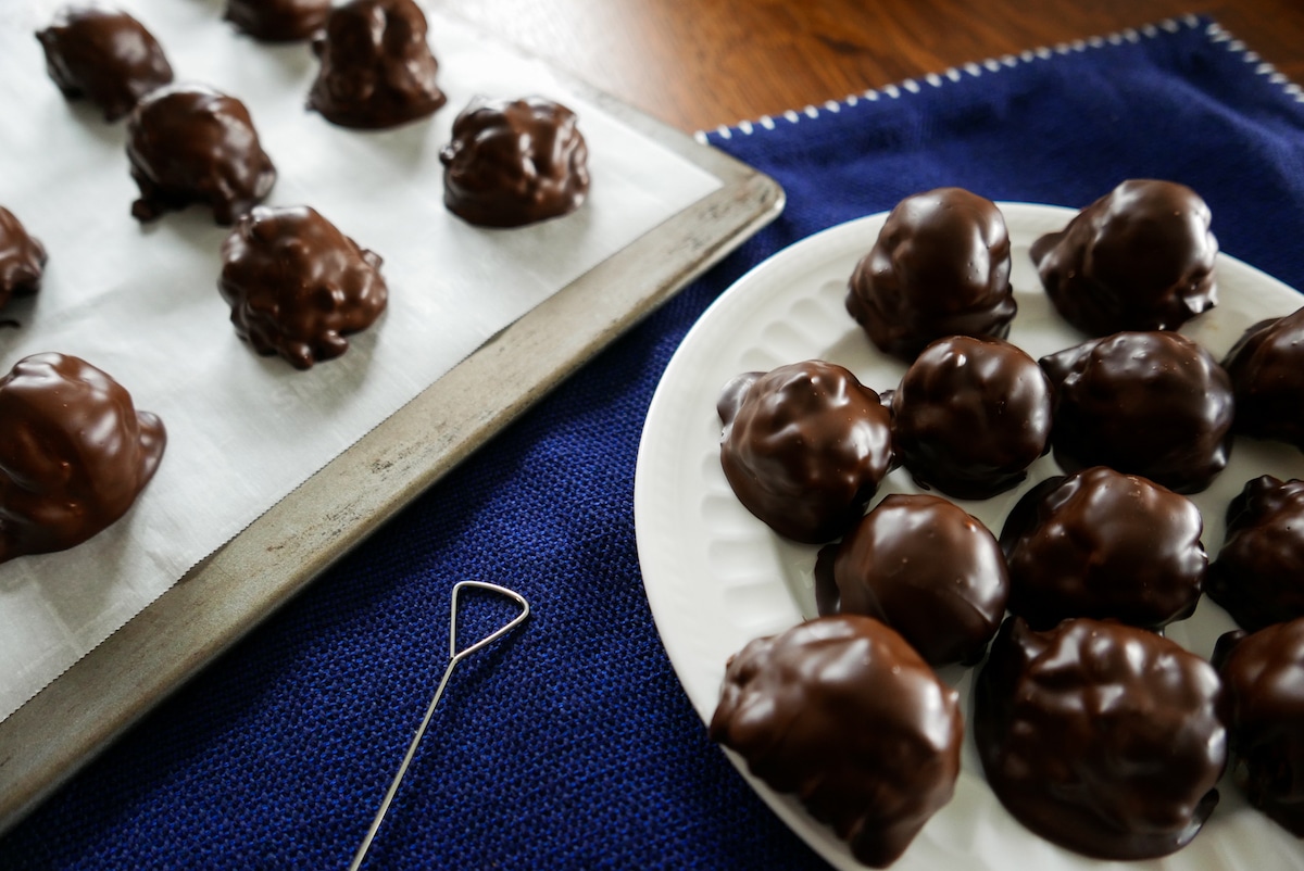 old fashioned peanut butter balls on a white plate peanut butter balls on a baking sheet