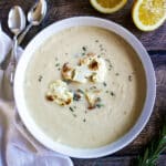 Creamy roasted cauliflower soup in a bowl.