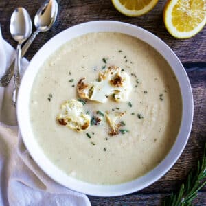Creamy roasted cauliflower soup in a bowl.