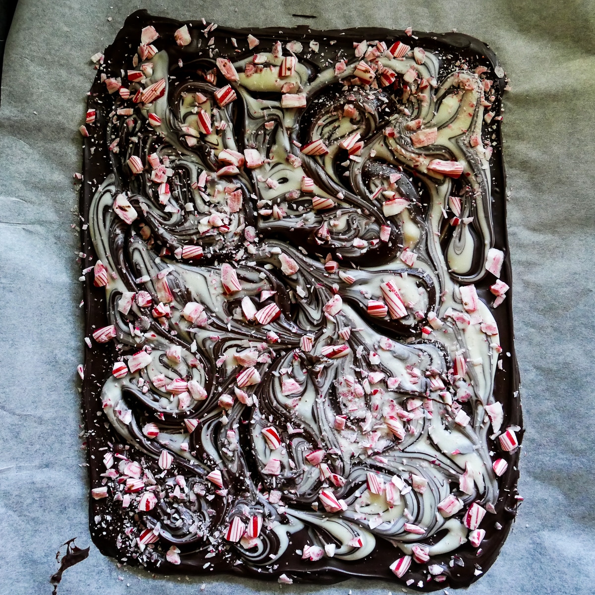melted white chocolate and peppermint candies swirled on top of dark chocolate.