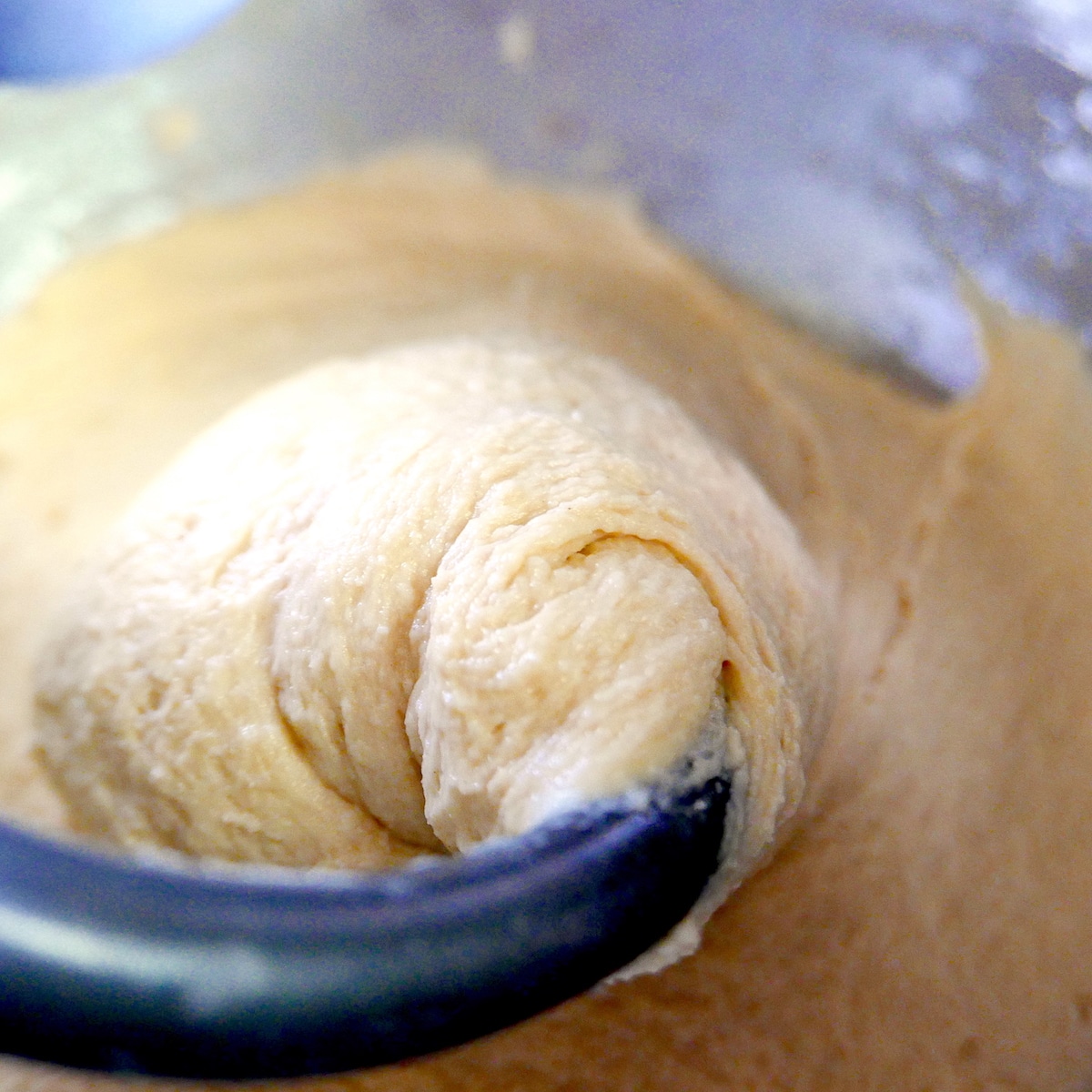 dough being mixed with dough hook.