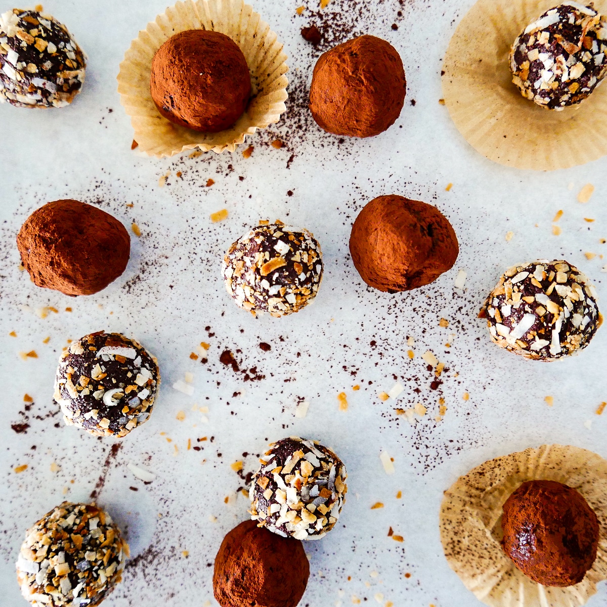 dairy free truffles arranged on a table with cocoa powder. 