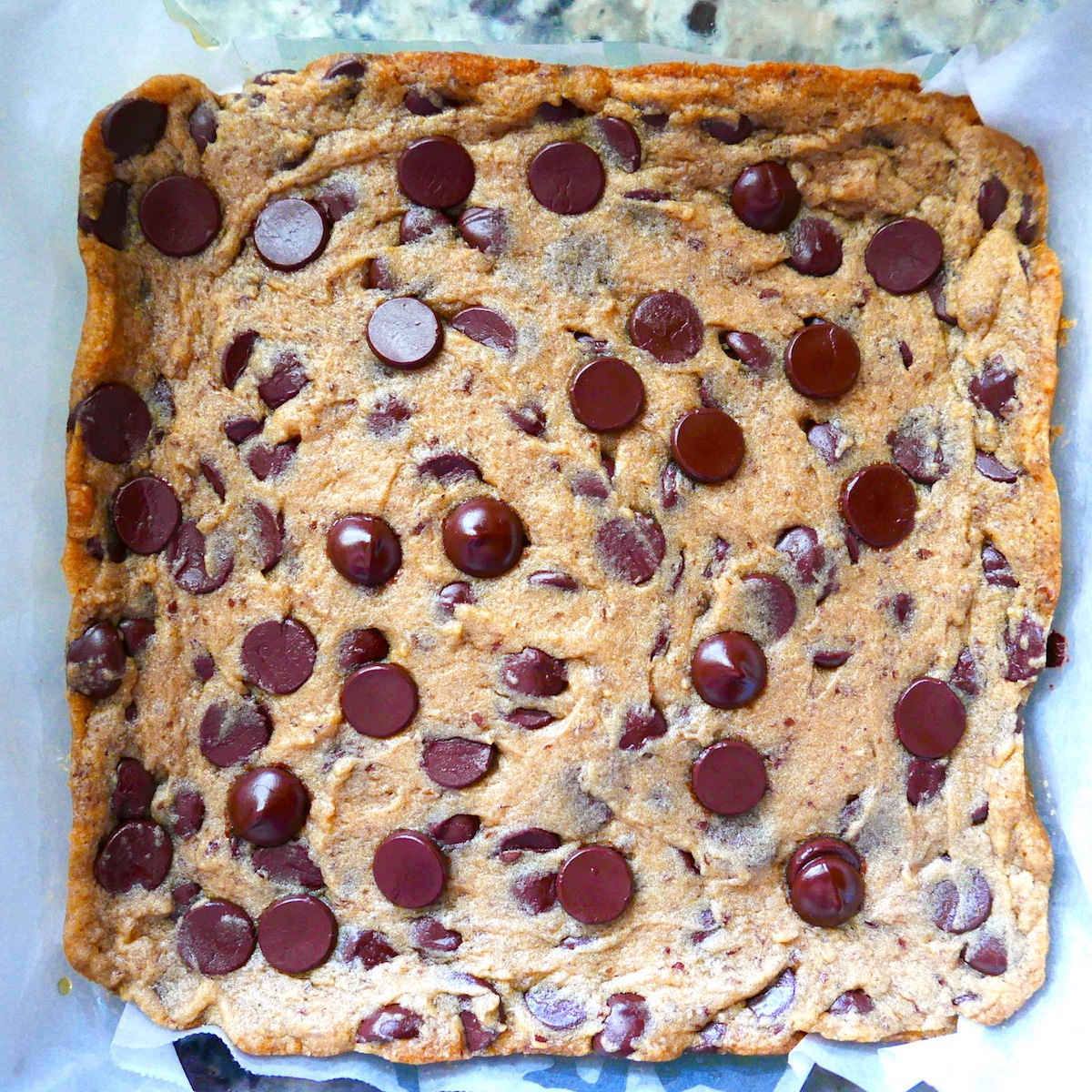 freshly baked blondies in a glass baking dish.