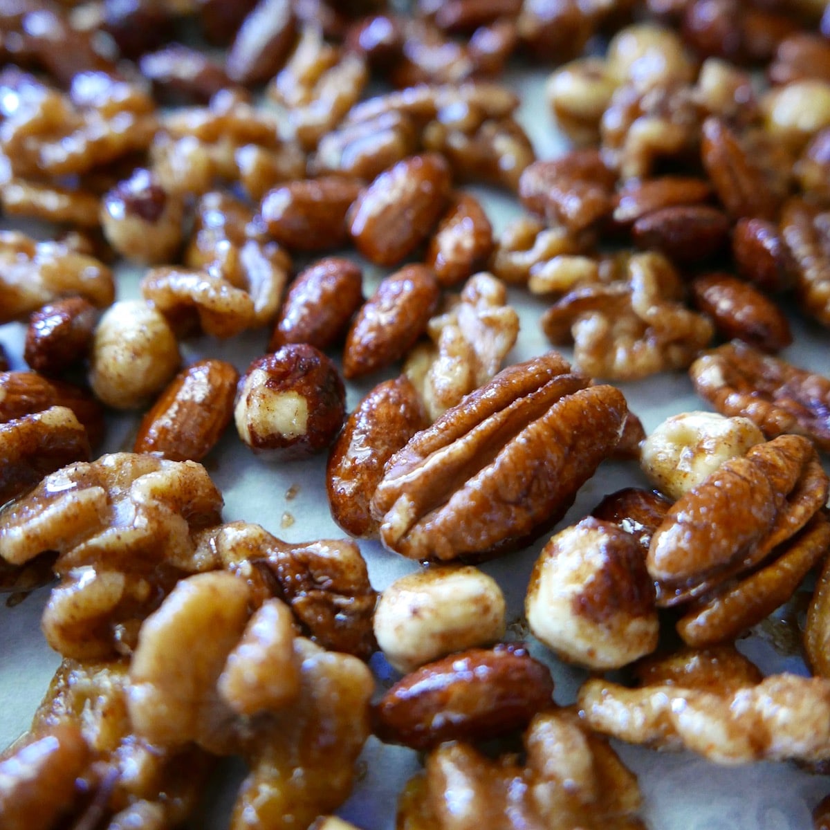mixed nuts on a baking sheet.