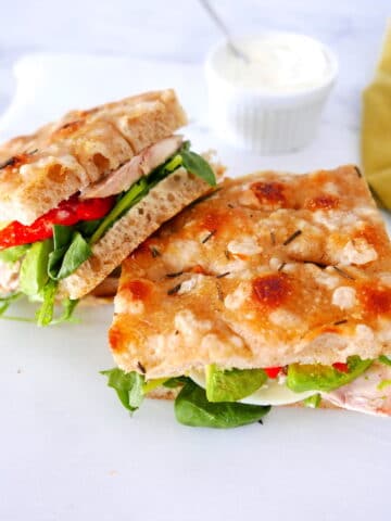 chicken focaccia sandwich arranged on a table.