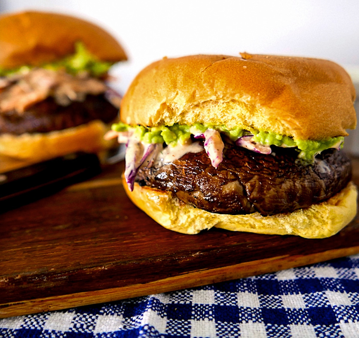 portobello-burger-with-ranch-coleslaw.jpg portobello burger with ranch coleslaw on a cutting board