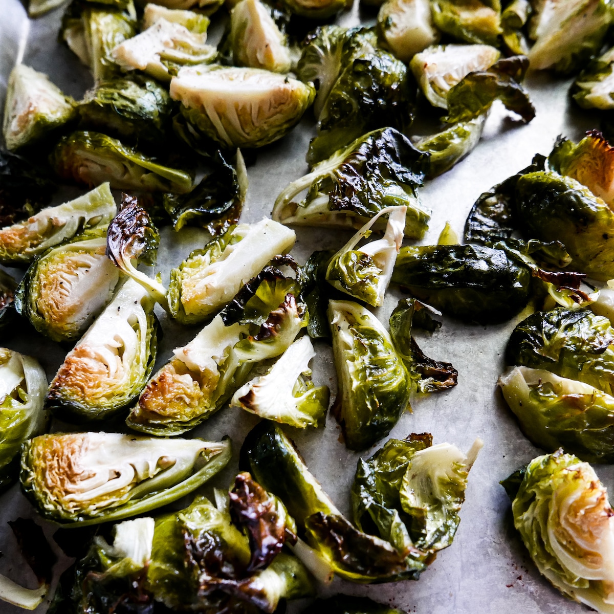 roasted-brussel-sprouts-on-baking-sheet.jpg Roasted brussel sprouts on a baking sheet.