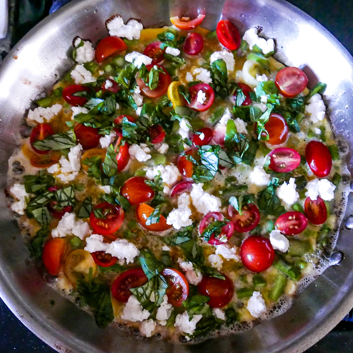 vegetables-eggs-and-goat-cheese-cooking-in-skillet.jpg vegetables, eggs, and goat cheese cooking in skillet.