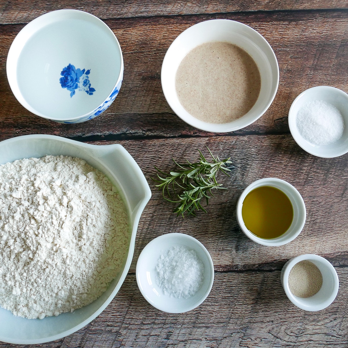 focaccia ingredients arranged on a table.