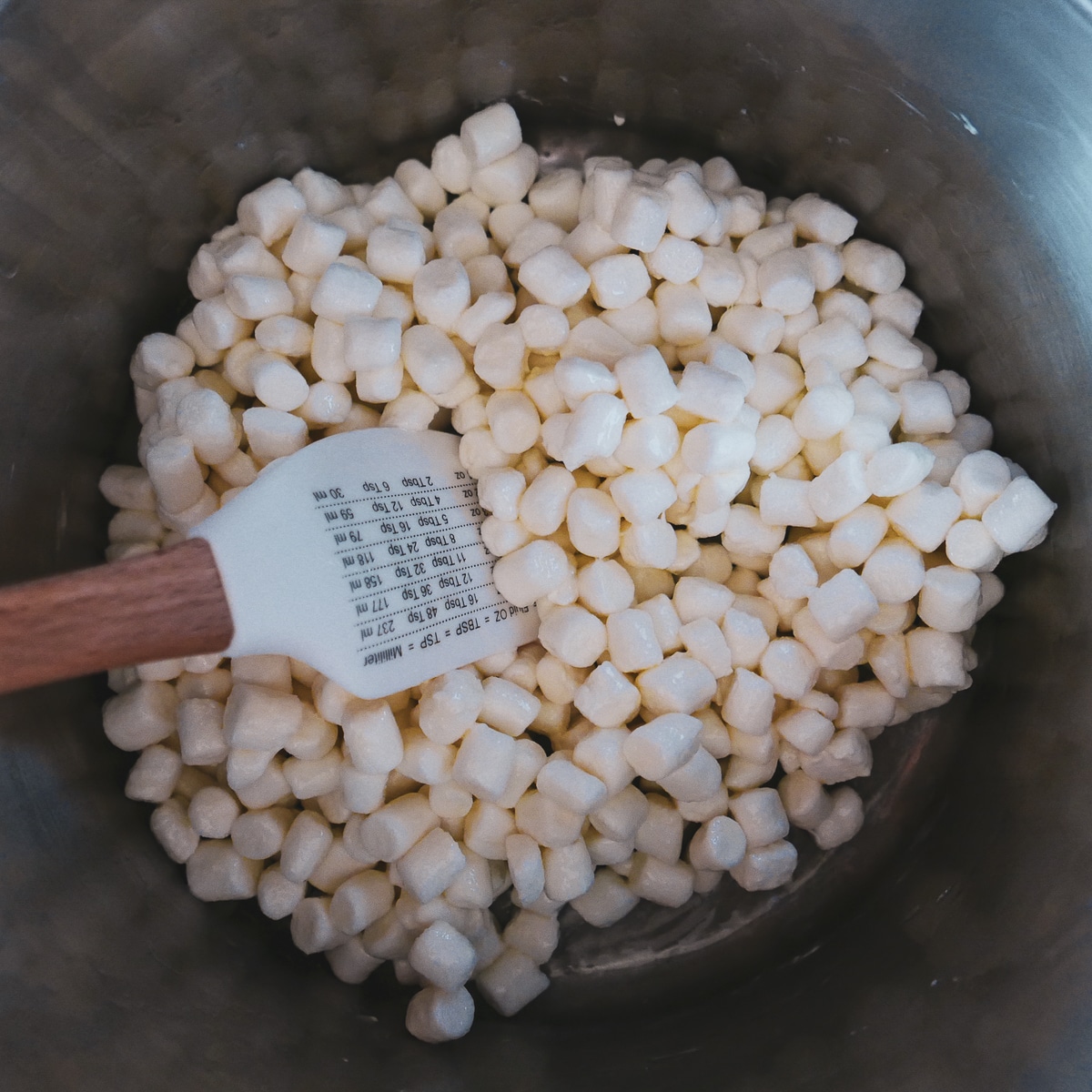 mini-marshmallows being melted in a pot.