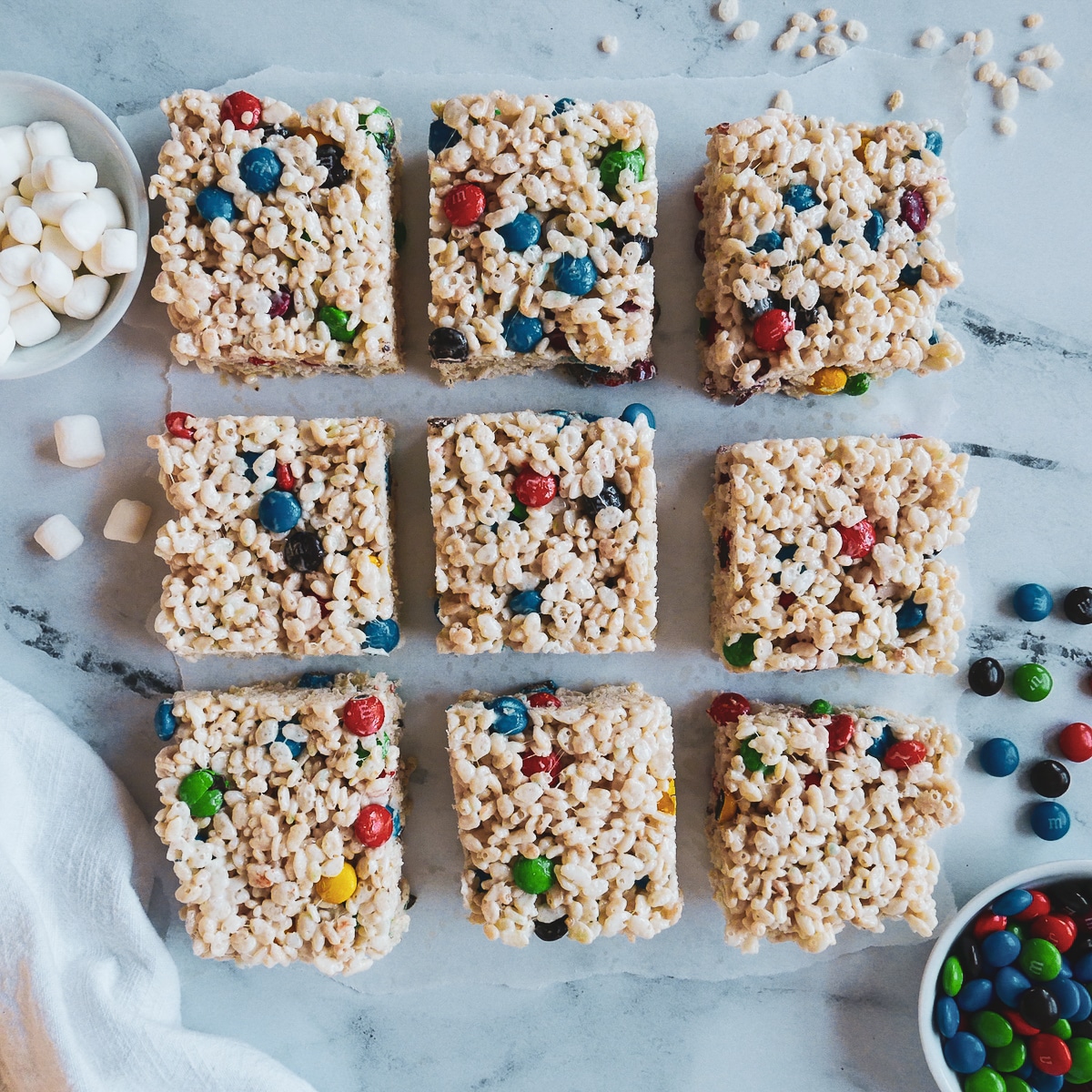 rice krispie treats cut into nine squares and arranged in a grid pattern. 