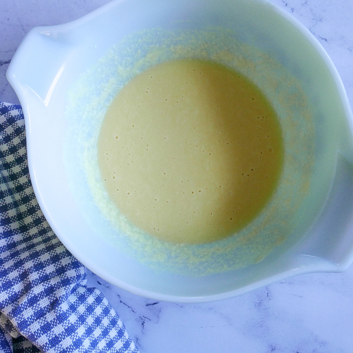 melted butter and yogurt whisked together in a mixing bowl.