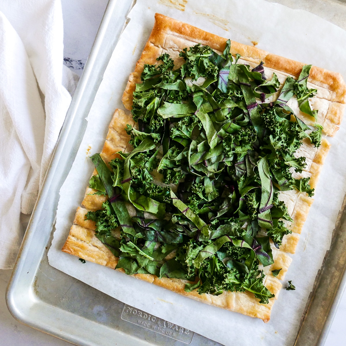 kale and beet greens on baked puff pastry.