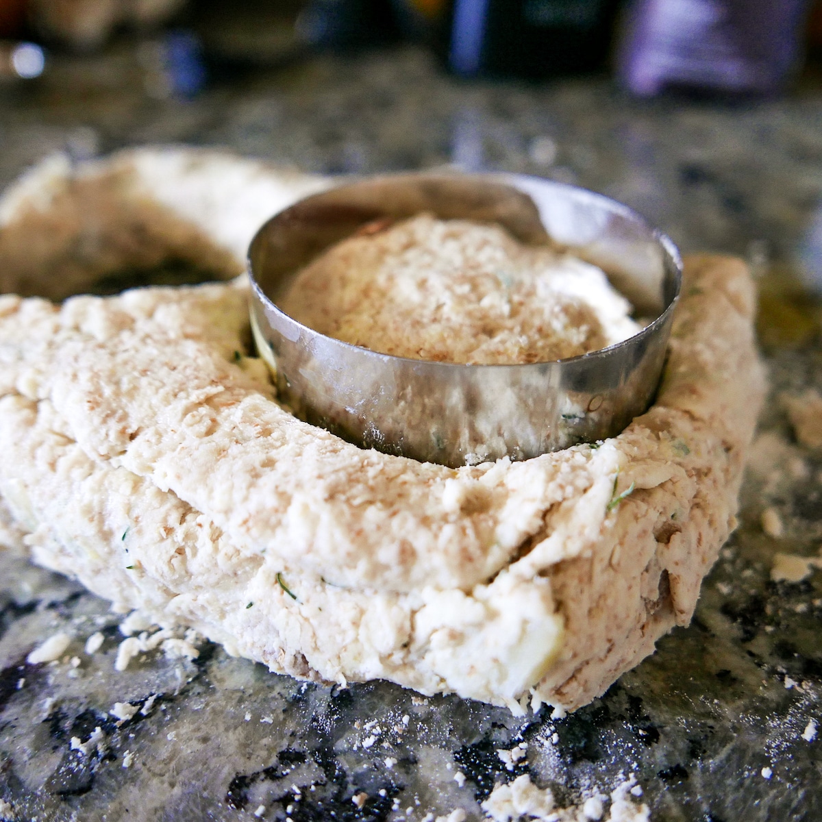 biscuit cutter cutting out biscuit.