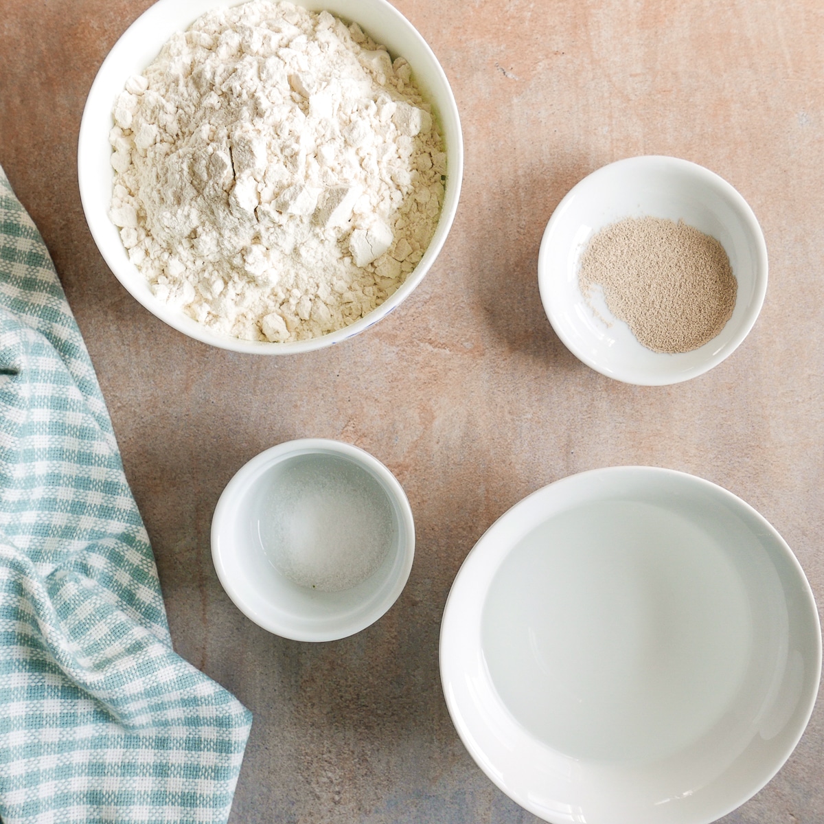 ciabatta roll ingredients arranged on a table.