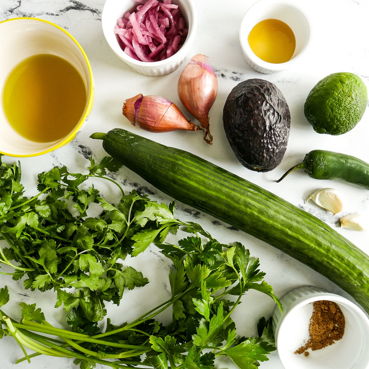 gazpacho ingredients arranged on a table.