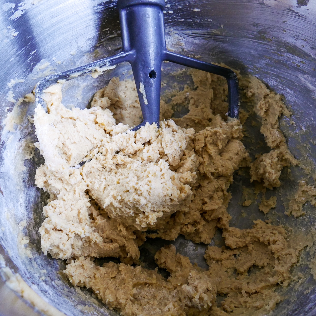 mixing dry ingredients into cookie dough. 
