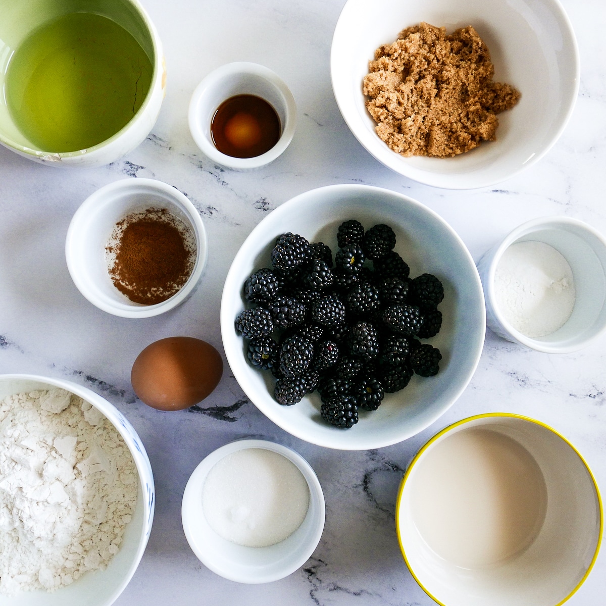 muffin ingredients arranged in bowls.