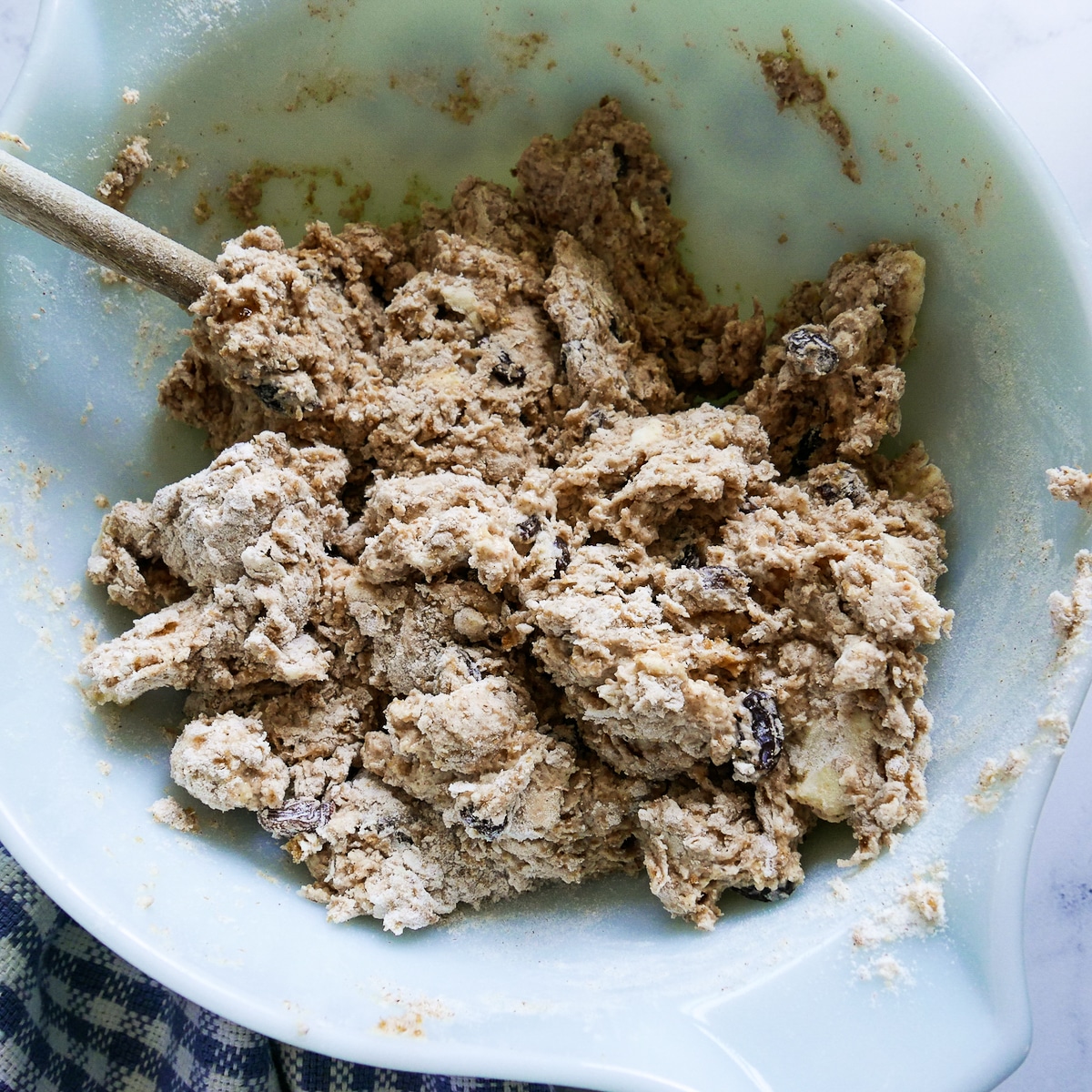 scone dough coming together in a mixing bowl.