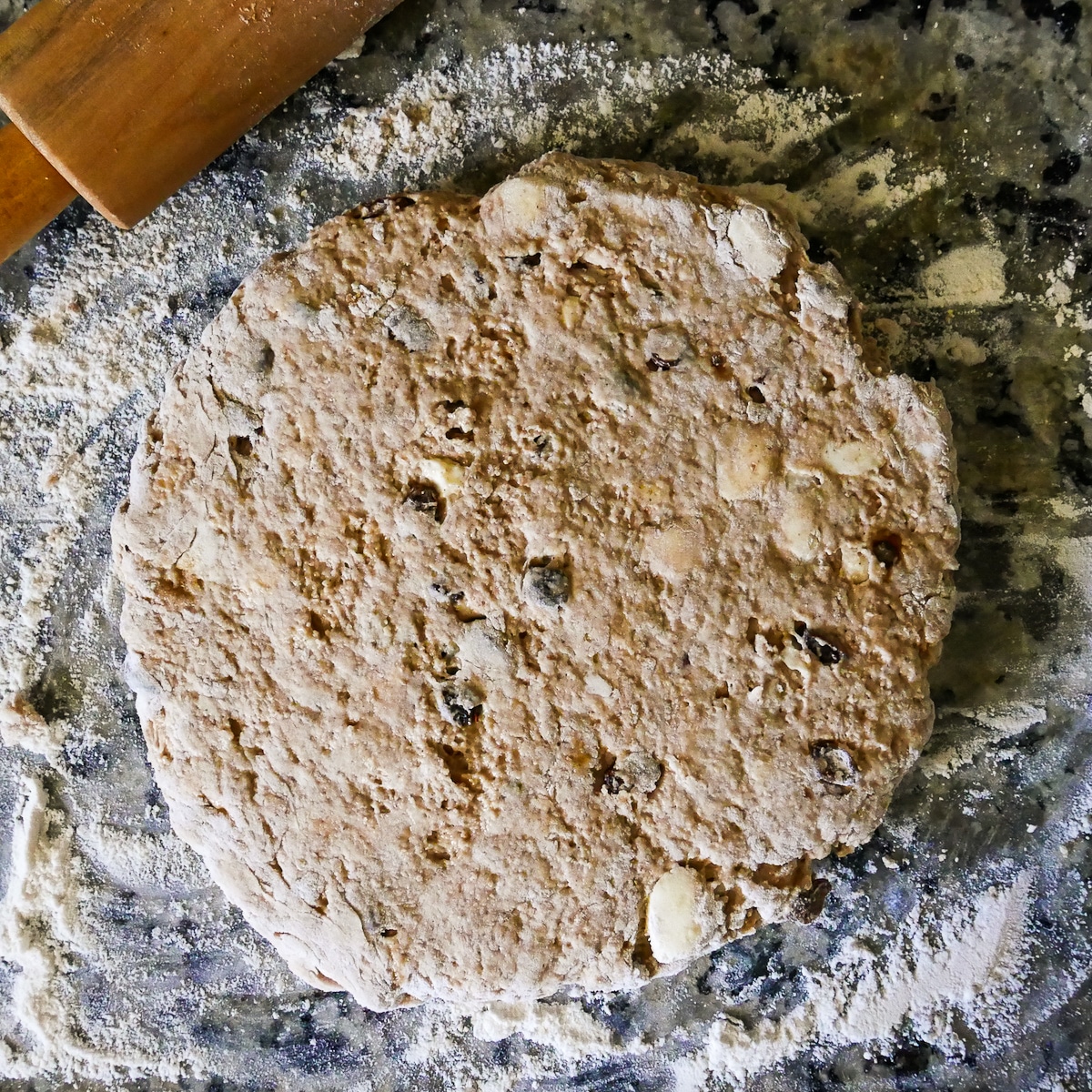 scone dough rolled out into a 9" round.