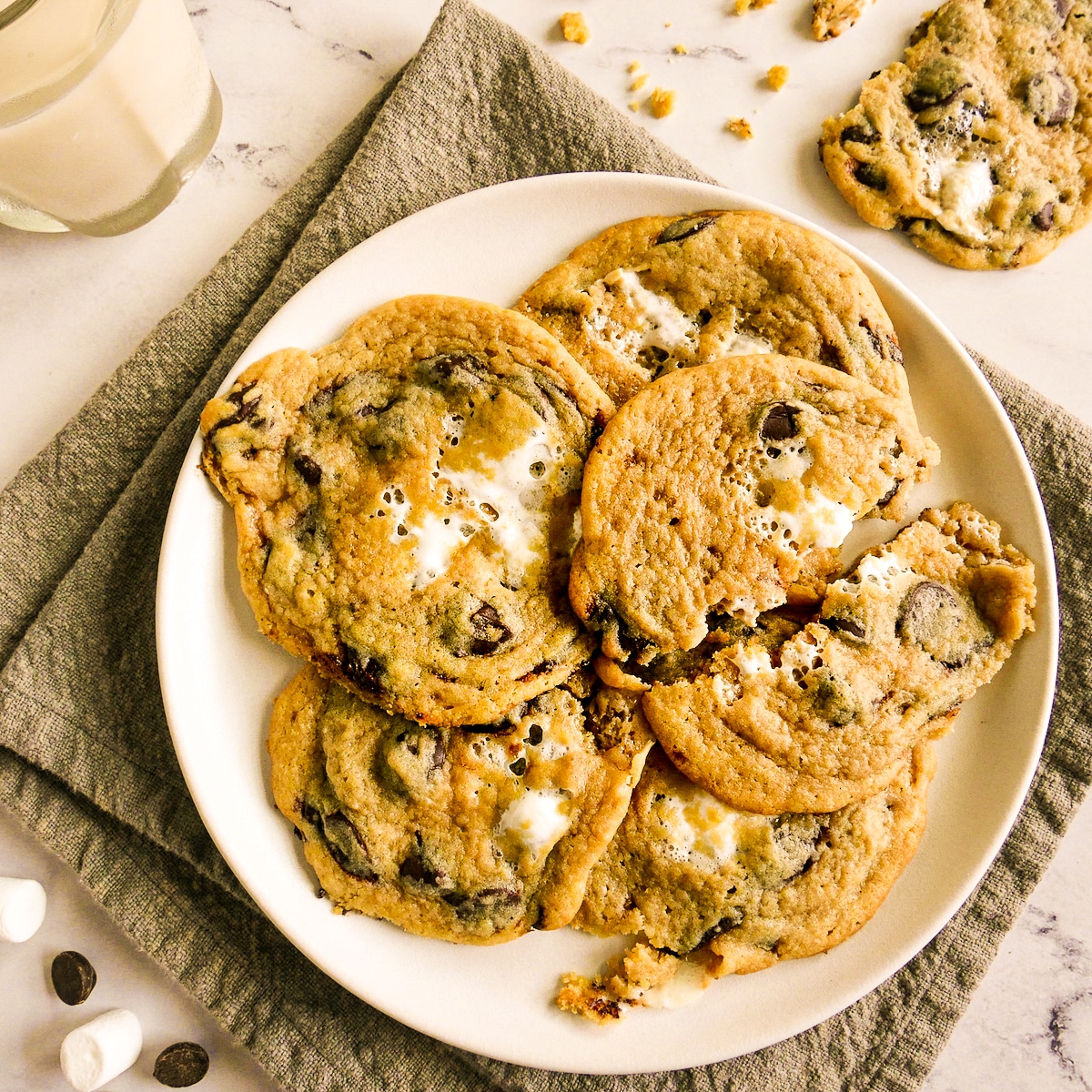 gooey-cookies-on-plate.jpg Gooey marshmallow chocolate chip cookies arranged on a white plate.