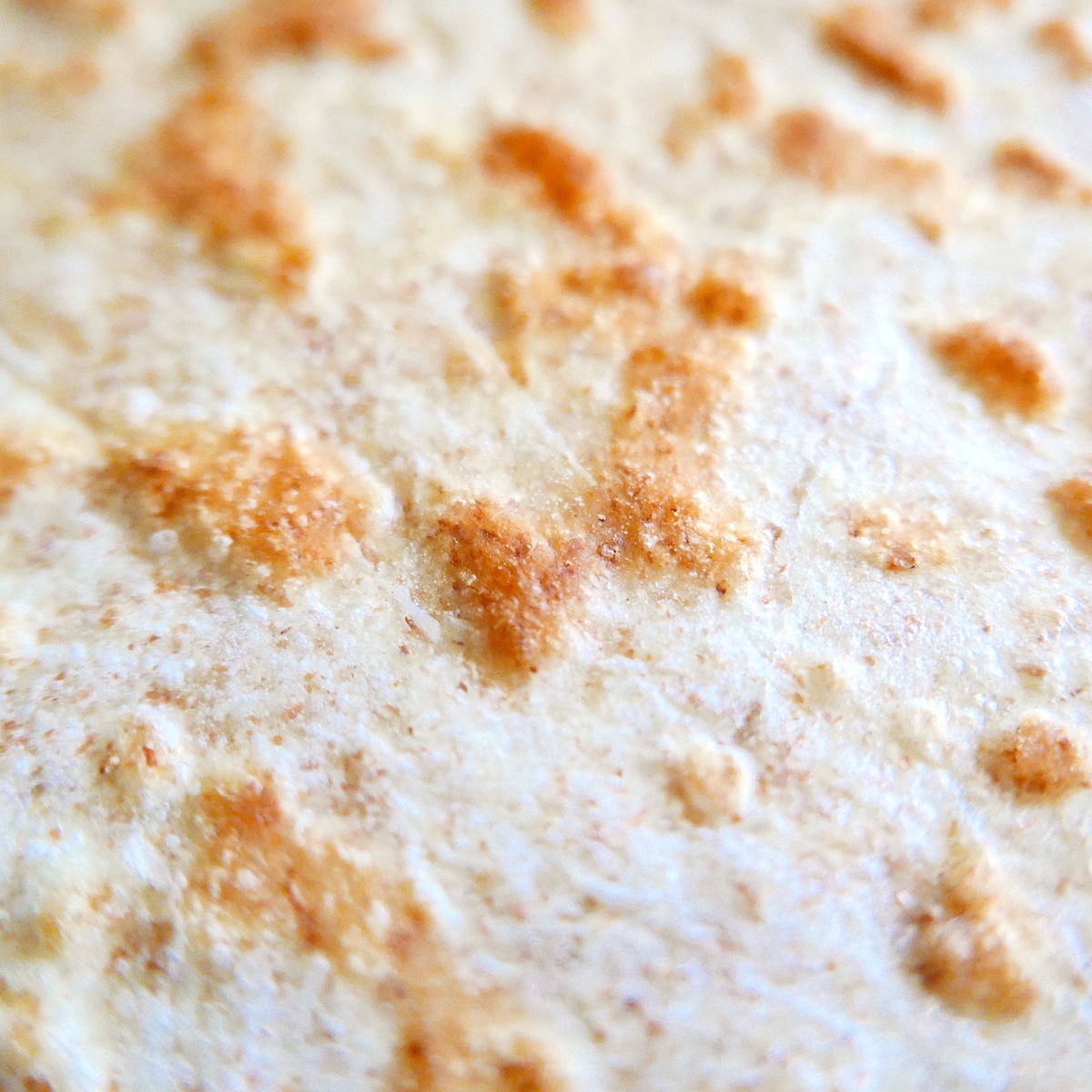 flatbread placed on baking sheet.