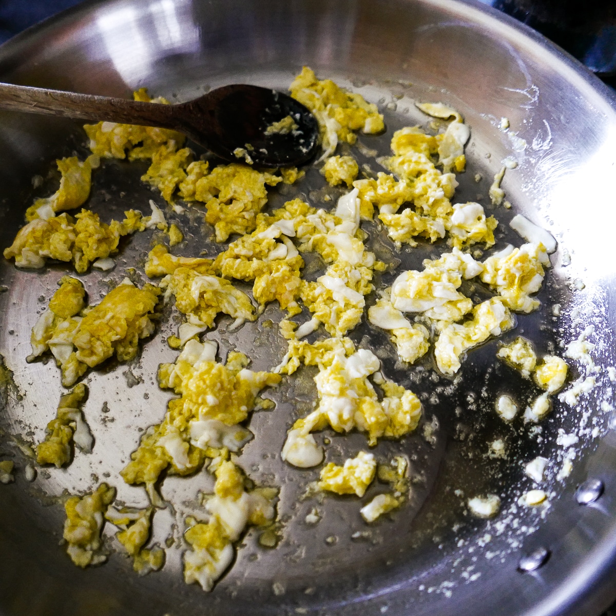 garlic-and-eggs-being-cooked.jpg Garlic and eggs being cooked in a large skillet.